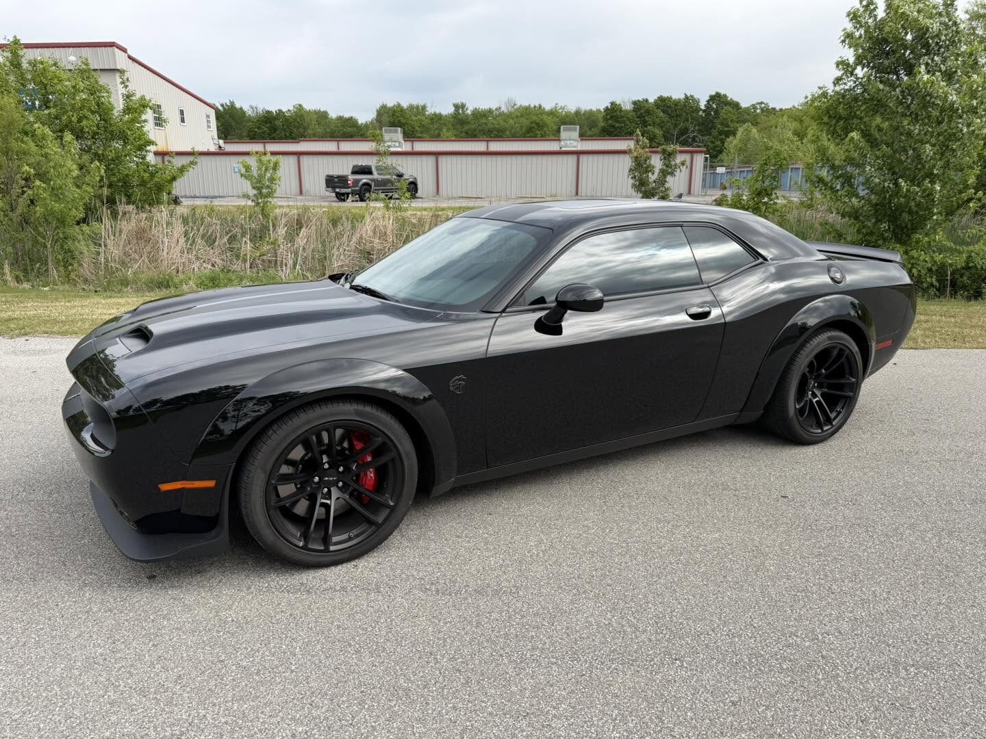 A gloss black Dodge Challenger ceramic coated by HD Auto Detail