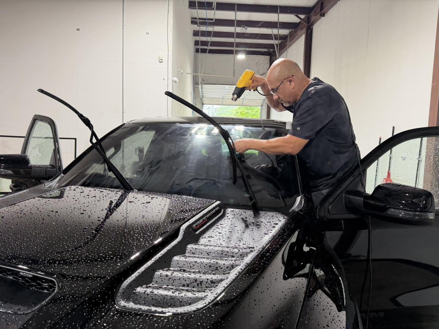 A vehicle being foam washed at HD Auto Detail